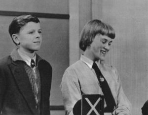 Two contestants in school uniform