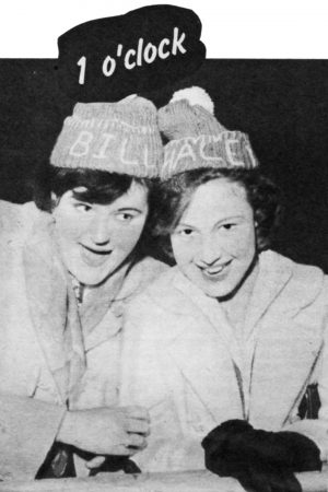 Two women in Bill Haley knitted bobble hats